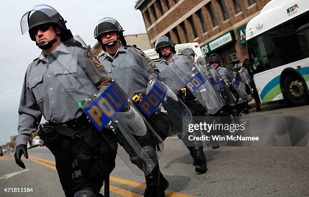 Pennsylvania State Troopers in riot gear deploy near the intersection of North Avenue and Pennsylvania Avenue May 1, 2015 in Baltimore, Maryland....