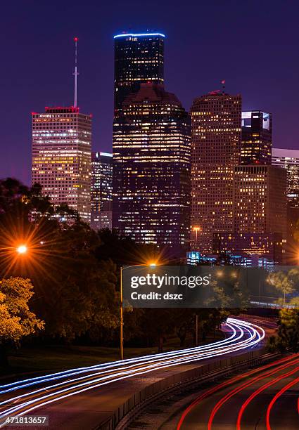 houston cityscape at night with traffic - houston texas stock pictures, royalty-free photos & images
