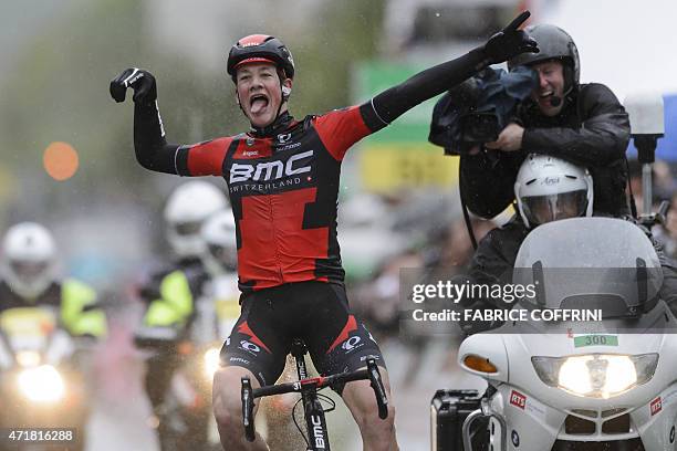 Swiss cyclist Stefan Kueng celebrates after winning the third stage, 169.8 km between La Neuveville and Fribourg, of the Tour de Romandie UCI World...