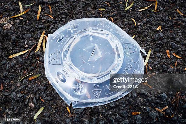 street litter: macdonald's plastic cup lid - lid stock pictures, royalty-free photos & images