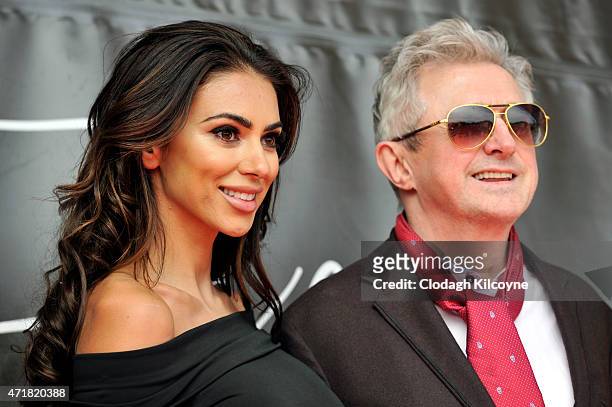Georgia Salpa and Louis Walsh judge best dressed lady at Punchestown Racecourse on May 1, 2015 in Naas, Ireland.