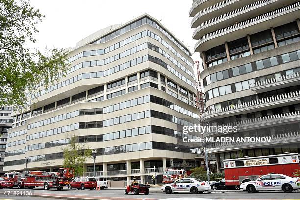 Emergency vehicles are seen outside the Watergate complex after two floors of the parking structure at the Watergate hotel collapsed in Washington,...