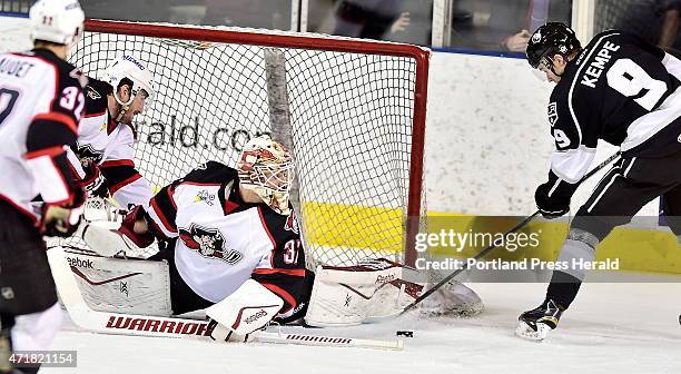 Pirates goalie, #37, Louis Domingue stops several attempts by Monarch, Adrian Kempe as the Portland Pirates host the Manchester Monarchs in AHL...