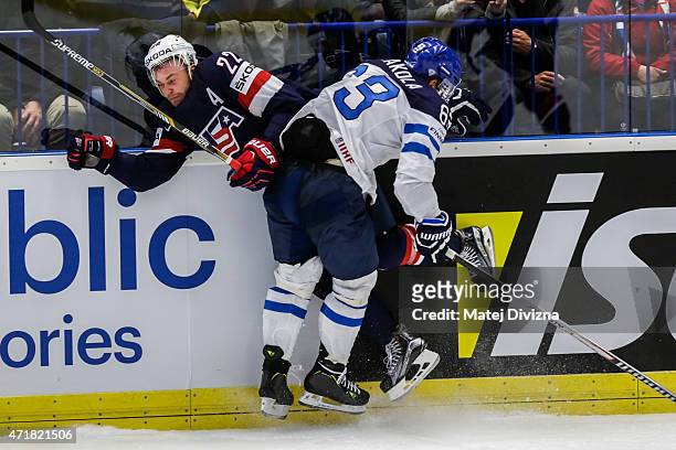 Trevor Lewis of USA and Topi Jaakola of Finland battle for the puck during the IIHF World Championship group B match between USA and Finland at CEZ...