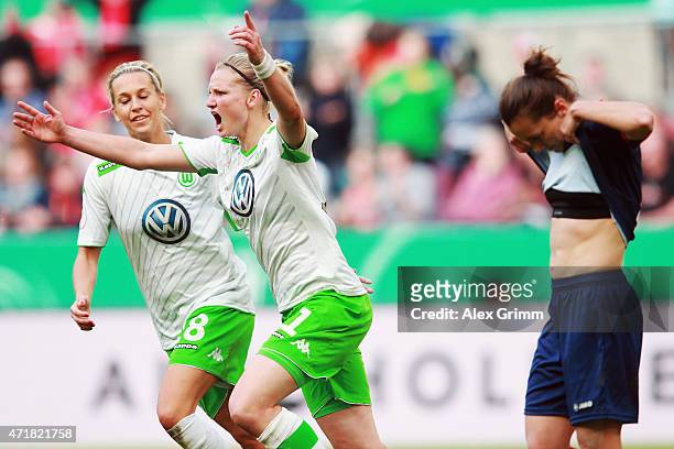 Alexandra Popp of Wolfsburg celebrates her team's third goal with team mate Lena Goessling as Lidija Kulis of Potsdam reacts during the Women's DFB...