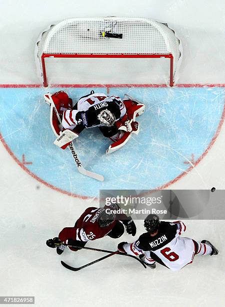 Mike Smith, goaltender of Canada stops th eshot of Andris Dzernis of Latvia during the IIHF World Championship group A match between Canada and...