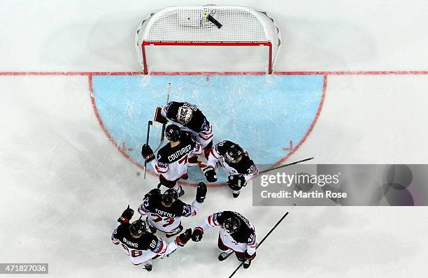 The team of Canada celebrate after winning after the IIHF World Championship group A match between Canada and Latvia at o2 Arena on May 1, 2015 in...