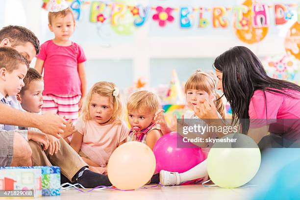 children playing with animators at birthday party. - animatör bildbanksfoton och bilder