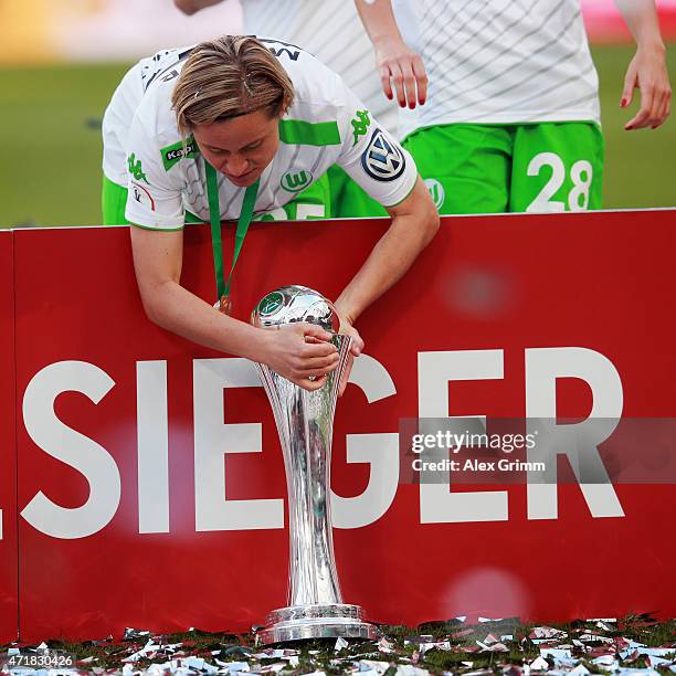 Martina Mueller of Wolfsburg celebrates with the trophy after winning the Women's DFB Cup Final between Turbine Potsdam and VfL Wolfsburg at...