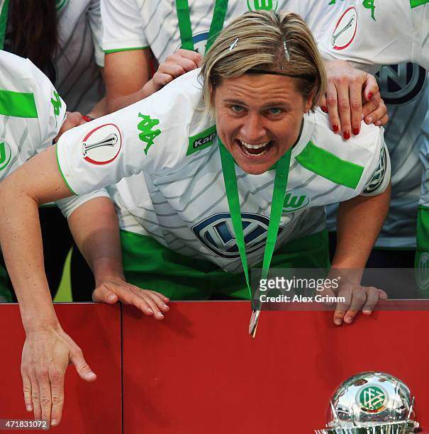 Martina Mueller of Wolfsburg celebrates with team mates after winning the Women's DFB Cup Final between Turbine Potsdam and VfL Wolfsburg at...