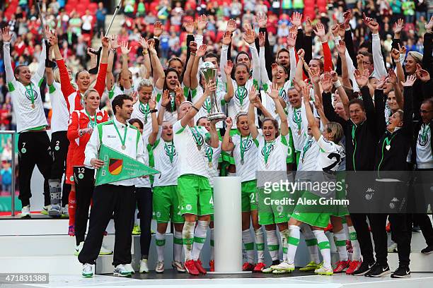 Players of Wolfsburg celebrate with the trophy after winning the Women's DFB Cup Final between Turbine Potsdam and VfL Wolfsburg at...