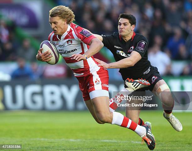 Billy Twelvetrees of Gloucester moves away from Sam Hidalgo-Clyne to score a try during the European Rugby Challenge Cup Final match between...