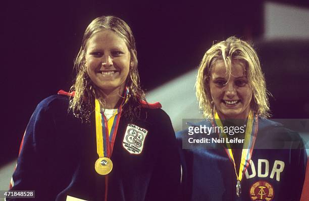 World Championships: Closeup of USA Shirley Babashoff and East Germany Kornelia Ender victorious on medal stand after Women's 200M Freestyle event at...