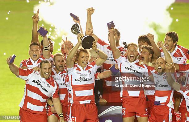 Billy Twelvetrees, the Gloucester captain, raises the trophy after their victory during the European Rugby Challenge Cup Final match between...