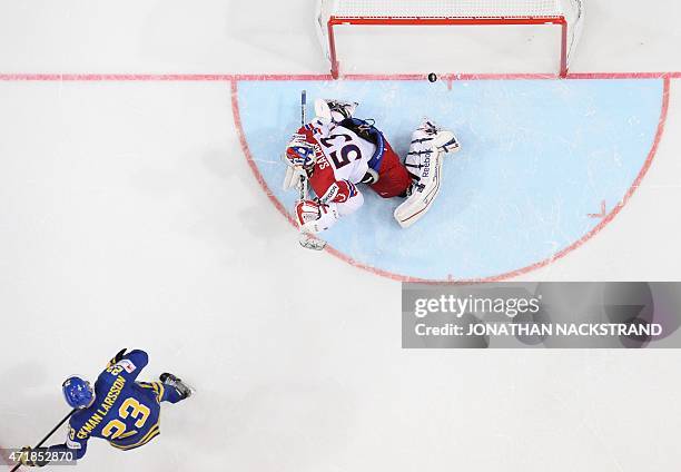 Sweden's defender Oliver Ekman-Larsson scores the game-winning goal past Czech Republic's goalkeeper Alexander Salak during the group A preliminary...