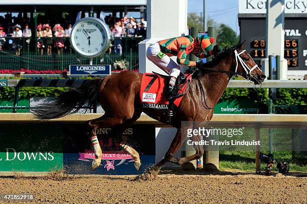 Jockey Kerwin D. Clark celebrates atop Lovely Maria after crossing the finish line to win the 141st running of the Kentucky Oaks at Churchill Downs...