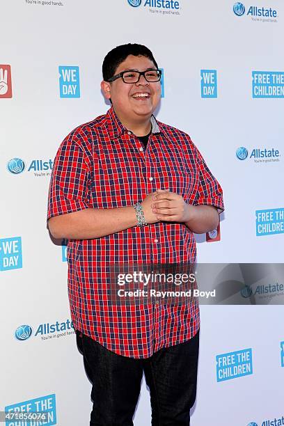 Actor Rico Rodriguez from the television show "Modern Family", poses for photos on the red carpet during "We Day" at the Allstate Arena on April 30,...