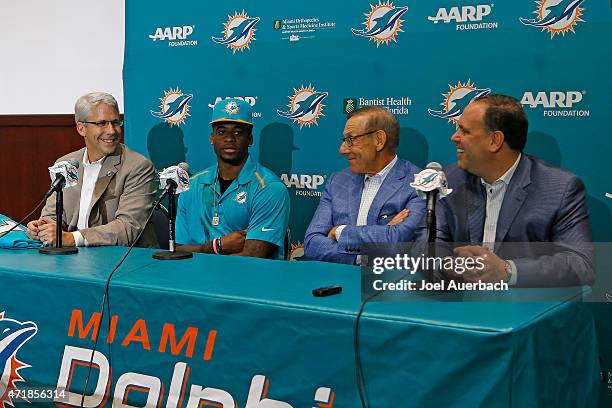 DeVante Parker talks to the media as General Manager Dennis Hickey, Chairman of the Board/Managing General Partner Stephen M. Ross, and Executive...