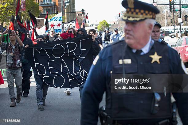 Demonstrators participate in a May Day march on May 1, 2015 in Chicago, Illinois. The demonstration was one of many around the world on what has...