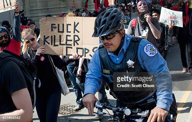 Demonstrators participate in a May Day march on May 1, 2015 in Chicago, Illinois. The demonstration was one of many around the world on what has...