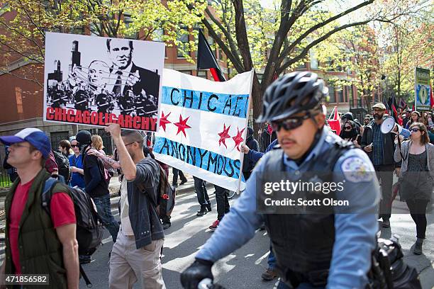 Demonstrators participate in a May Day march on May 1, 2015 in Chicago, Illinois. The demonstration was one of many around the world on what has...