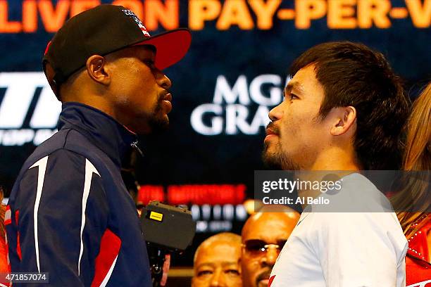 Floyd Mayweather Jr. And Manny Pacquiao face off during their official weigh-in on May 1, 2015 at MGM Grand Garden Arena in Las Vegas, Nevada. The...