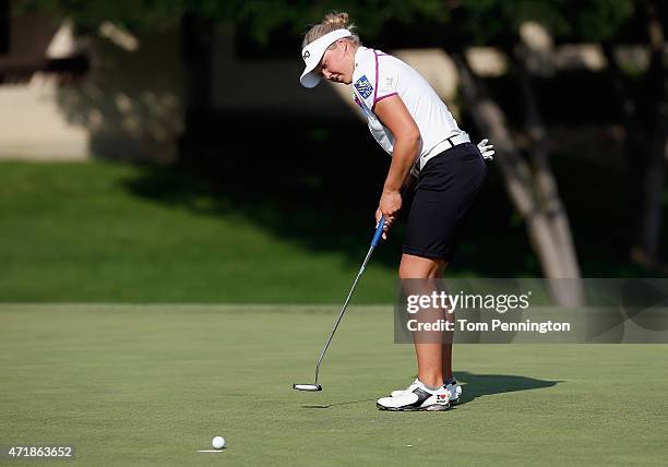 Brooke M. Henderson of Canada putts the ball on the ninth hole during Round Two of the 2015 Volunteers of America North Texas Shootout Presented by...