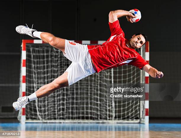 male handball player in action. - handball stock pictures, royalty-free photos & images