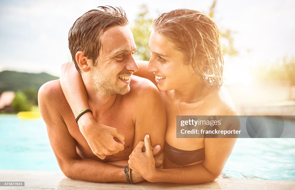 Couple of lovers at the swimming pool