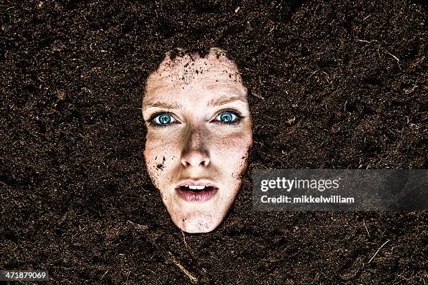 portrait of woman who is buried in a garden - dirty women pics stock pictures, royalty-free photos & images