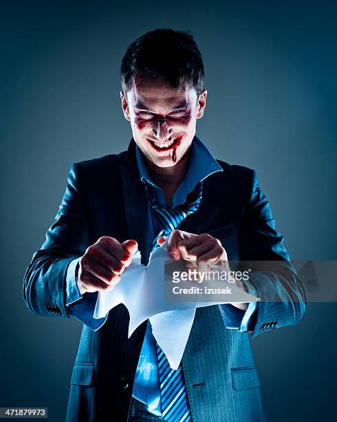 businessman tearing paper - revenge stock pictures, royalty-free photos & images