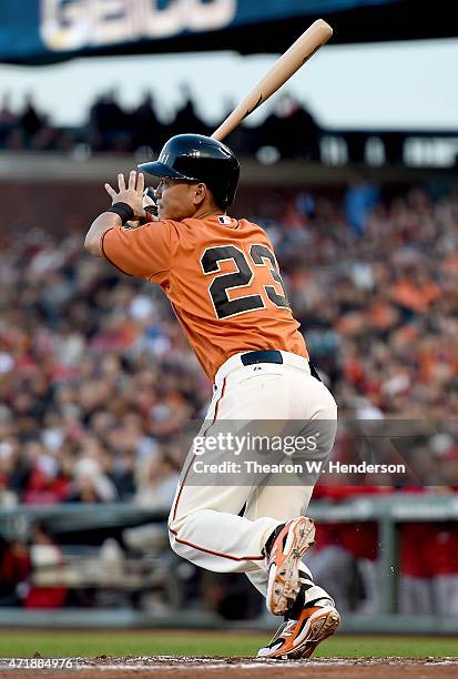 Nori Aoki of the San Francisco Giants hits a double against the Los Angeles Angels of Anaheim in the bottom of the first inning at AT&T Park on May...