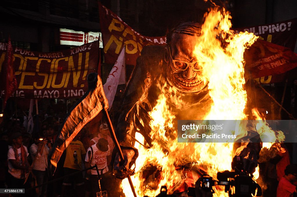 Protesters set the effigy of President Benigno Aquino III on...