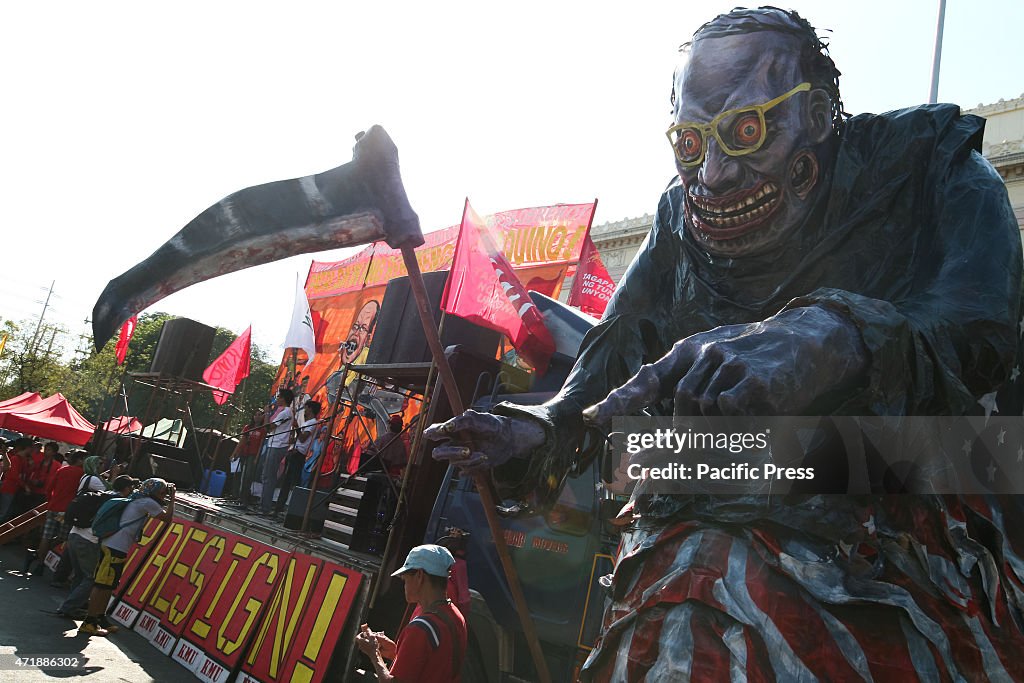 An effigy of President Aquino as the Grimm Reaper in...