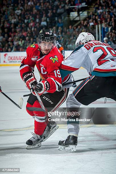 Nicolas Petan of Portland Winterhawks deals around Leon Draisaitl of Kelowna Rockets after the face off in the second period of game 5 of the Western...