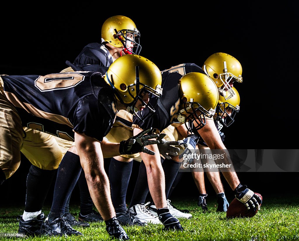 American football players lining up.