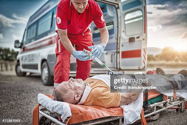 rescue team save lives - red cross ambulance stock pictures, royalty-free photos & images