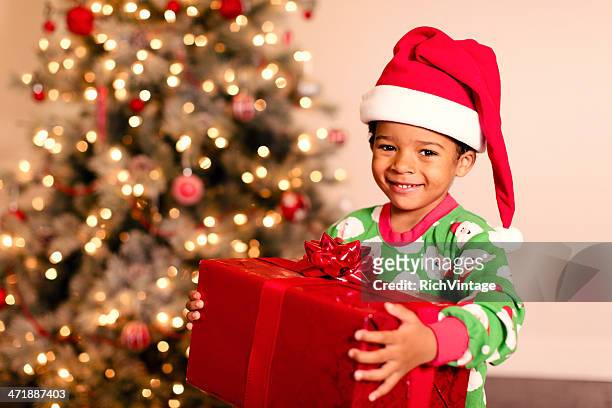 christmas morning - santa hat stock pictures, royalty-free photos & images