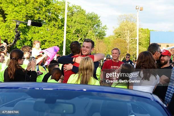 Clark Beckham hugs a friend during his homecoming on May 1, 2015 in White House, Tennessee.