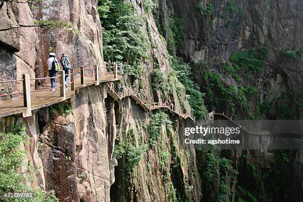 ledge path on huangshan - huangshan mountains stock pictures, royalty-free photos & images