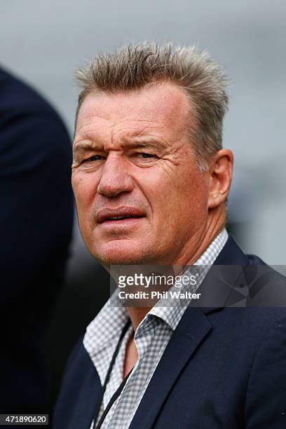 Blues coach Sir John Kirwan watches the curtain raiser match before the round 12 Super Rugby match between the Blues and the Force at Eden Park on...