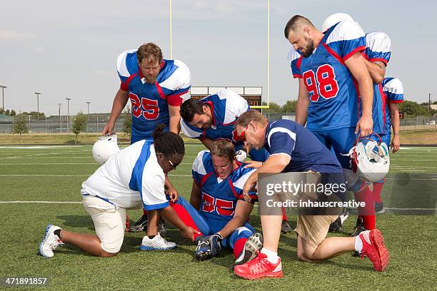 injured football player - injured football player stock pictures, royalty-free photos & images