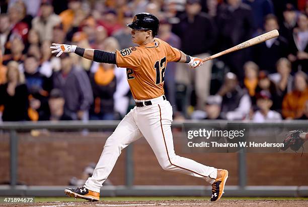 Joe Panik of the San Francisco Giants hits a pitch-hit walk-off rbi single scoring Gregor Blanco against the Los Angeles Angels of Anaheim in the...