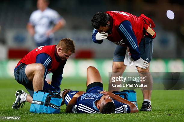 Charles Piutau of the Blues lies injured on the field during the round 12 Super Rugby match between the Blues and the Force at Eden Park on May 2,...