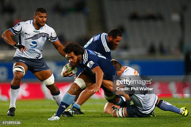 Steven Luatua of the Blues is tackled during the round 12 Super Rugby match between the Blues and the Force at Eden Park on May 2, 2015 in Auckland,...