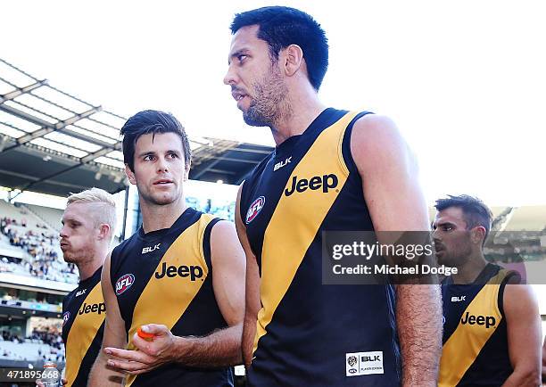 Trent Cotchin of the Tigers and Troy Chaplin walk off after defeat during the round five AFL match between the Richmond Tigers and the Geelong Cats...