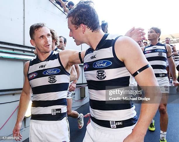 Joel Selwood and Mitch Duncan of the Cats celebrates the win during the round five AFL match between the Richmond Tigers and the Geelong Cats at...