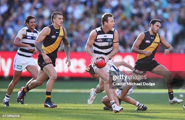 Steve Johnson of the Cats runs with the ball during the round five AFL match between the Richmond Tigers and the Geelong Cats at Melbourne Cricket...