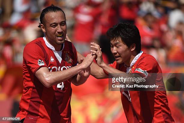Marcus Tulio Tanaka of Nagoya Grampus celebrates 3rd goal with Kensuke Nagai of Nagoya Grampus during the J.League match between Nagoya Grampus and...