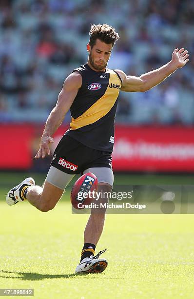 Alex Rance of the Tigers kicks the ball during the round five AFL match between the Richmond Tigers and the Geelong Cats at Melbourne Cricket Ground...